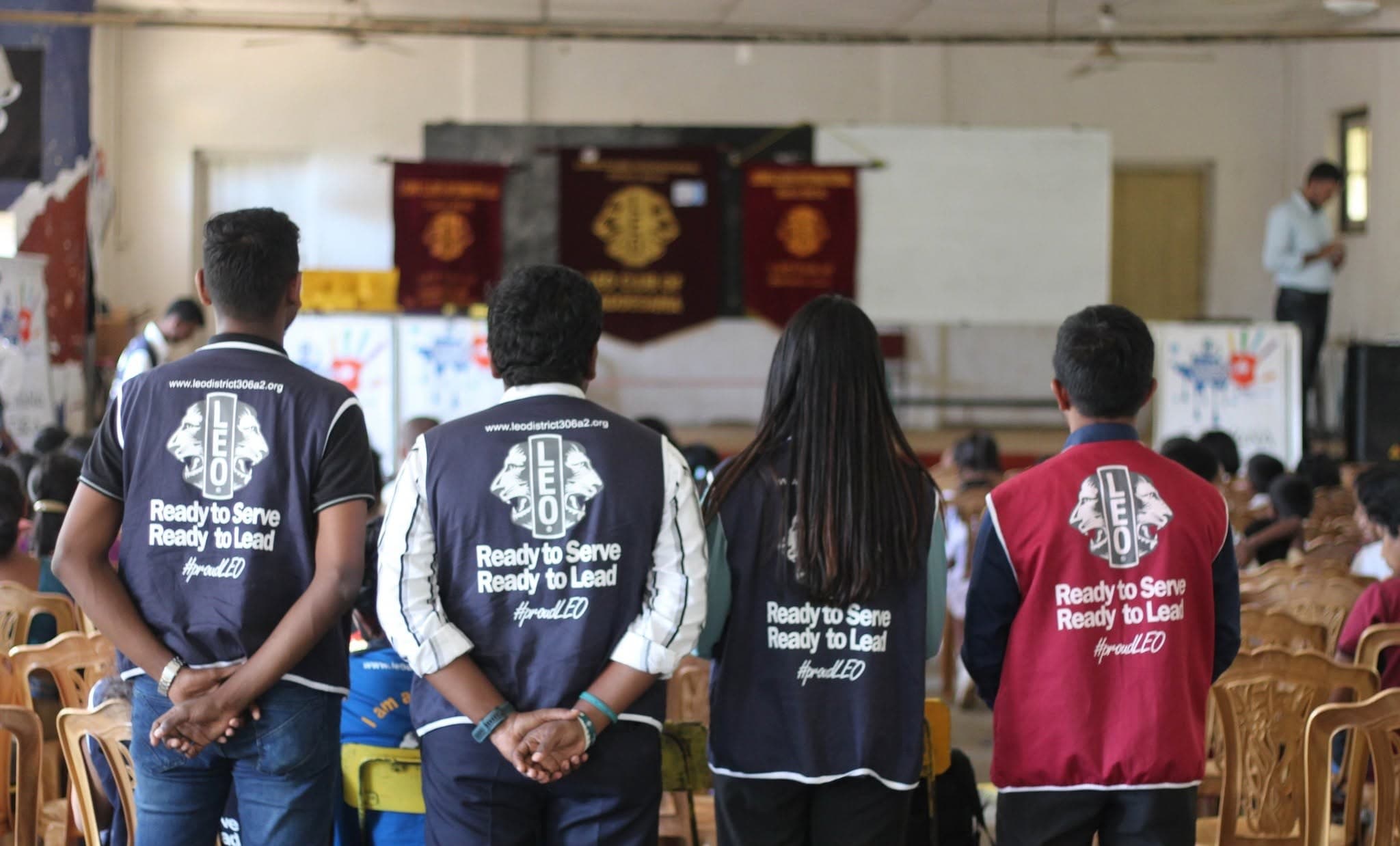 Leos in district jackets at a community project in Walapane